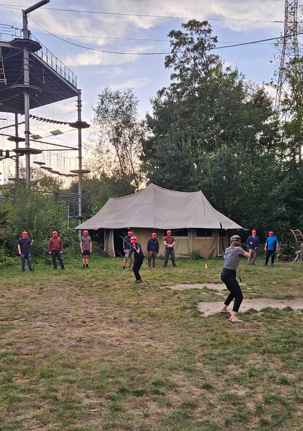 Employees in the midst of an ArrowTag match, demonstrating dynamic play and competitive spirit during a team-building exercise that promotes active collaboration and a healthy workplace.