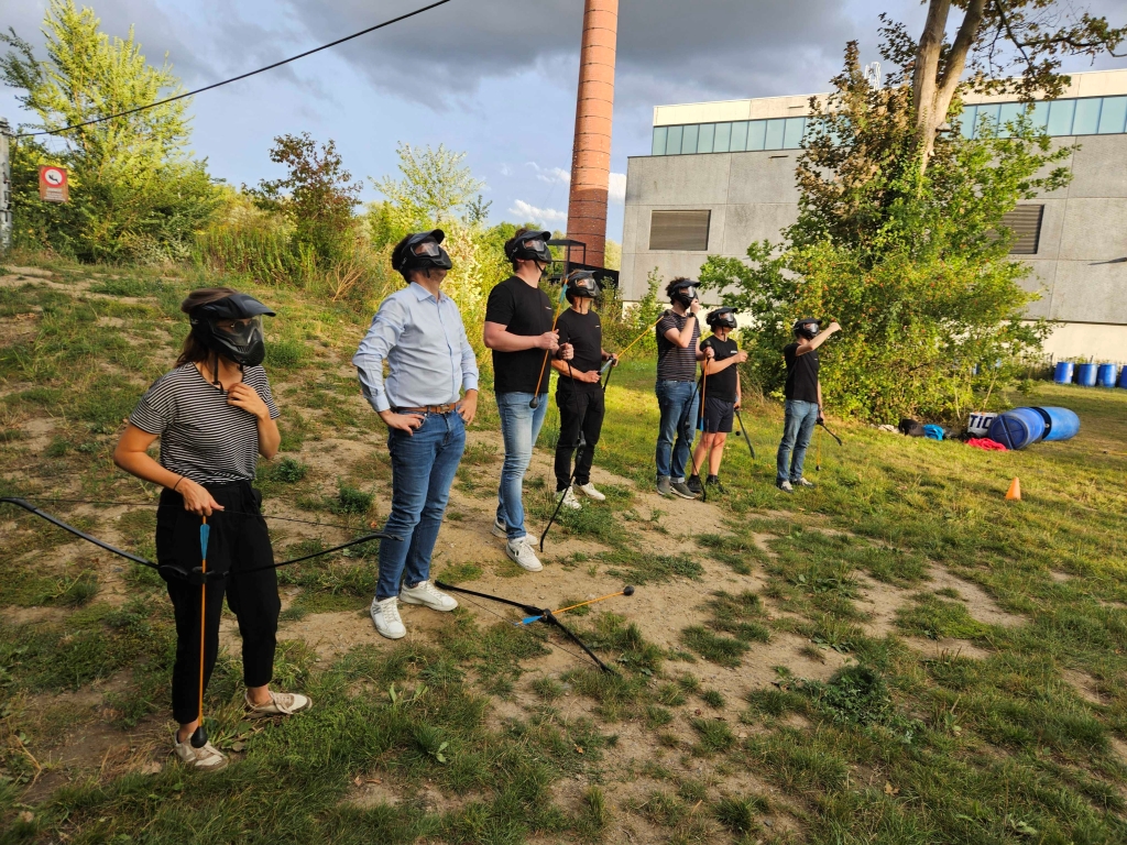 Team members preparing for an ArrowTag challenge, receiving instructions and gearing up for an exciting corporate event focused on teamwork, strategy, and fun.