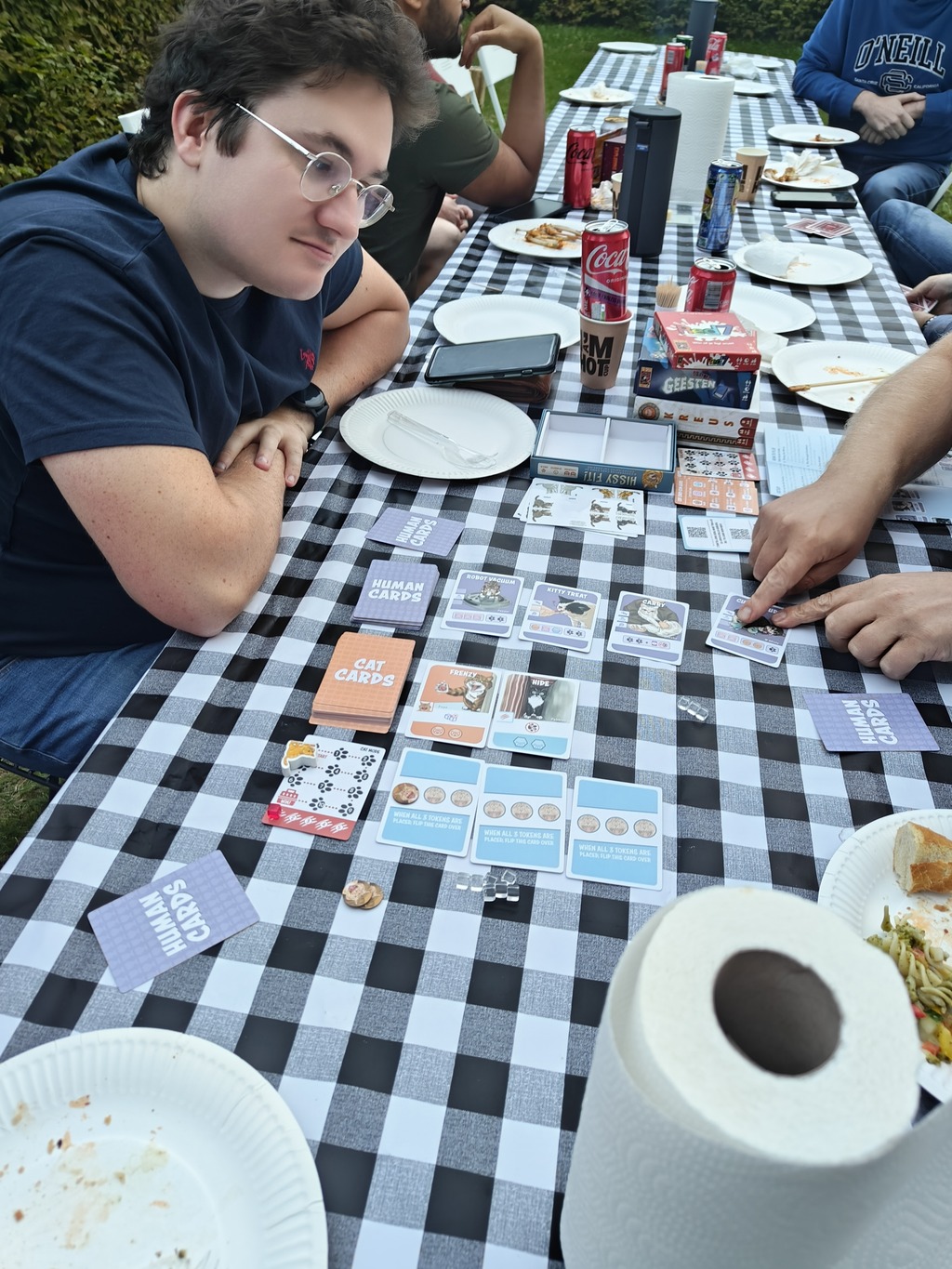 Colleagues engage in a competitive board game, mixing strategy and IT camaraderie.