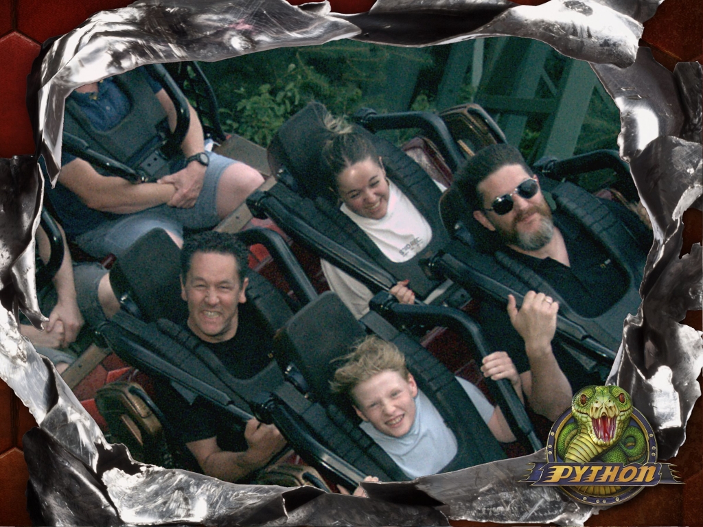 Itenium team members and their children experiencing an exhilarating ride on Efteling's Python rollercoaster, symbolizing the excitement and team spirit of the company's family outing.