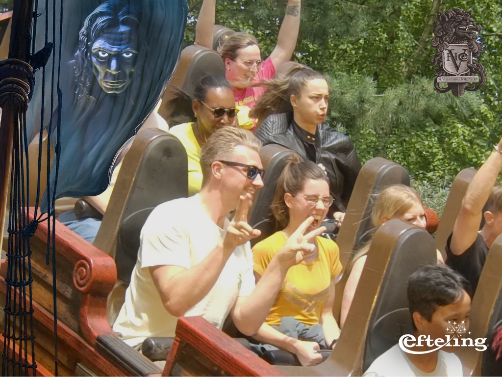 Itenium team members and their families expressing pure joy and excitement on a thrilling Efteling rollercoaster, embodying the spirit of fun and adventure at the corporate family event.