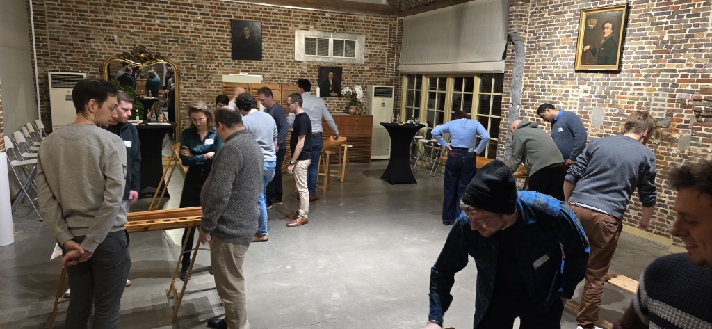 Colleagues at Itenium’s New Year Event 2025 enjoy wooden tabletop games in a stylish venue, fostering teamwork and fun.