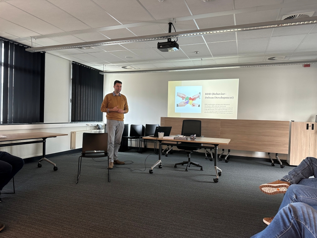 An expert speaker presenting on BDD (Behavior-Driven Development) during the Testing Track learning series, providing in-depth insights into software testing best practices for developers and QA professionals