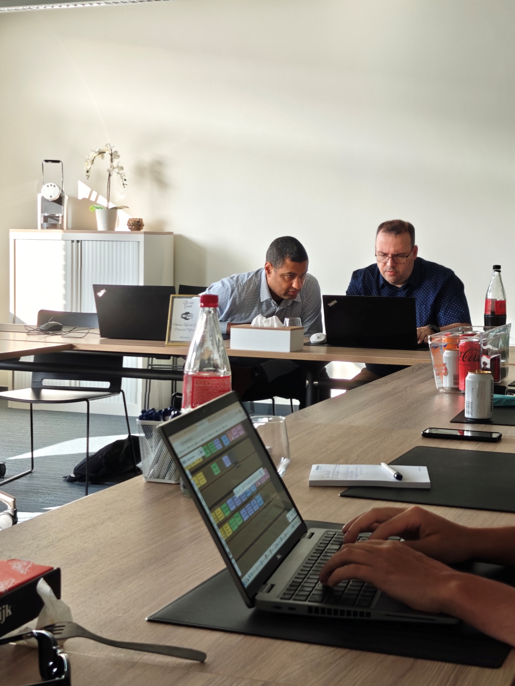 Attendees at an Itenium Requirements Elicitation workshop deeply focused on practical exercises, honing their skills in requirements gathering and functional analysis for real-world projects.